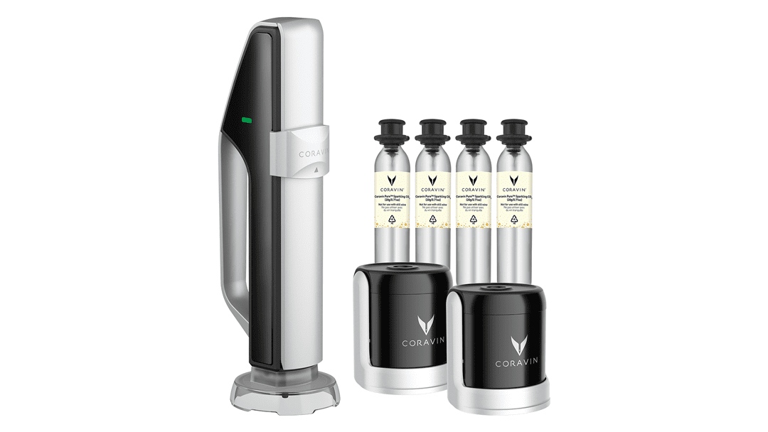 Coravin wine preservation system with four gas capsules and a standing base, designed for pouring wine by glass.