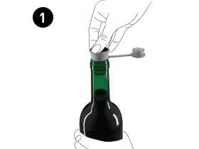 Hand holding a bottle while inserting a cork with a pull tab into the bottle's neck, labeled step 1.