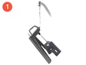 Water flows from a faucet onto a gray tool with a hanging weight, labeled as step 1 in a process.