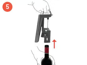 Hand holding a wine opener above a wine bottle, with a red arrow indicating upward movement. Step 5 of opening a bottle.